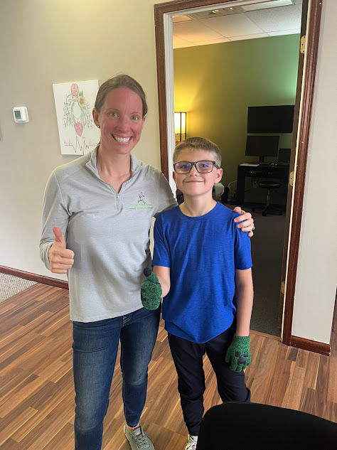 Pediatric chiropractor helping a child with recurring ear infections