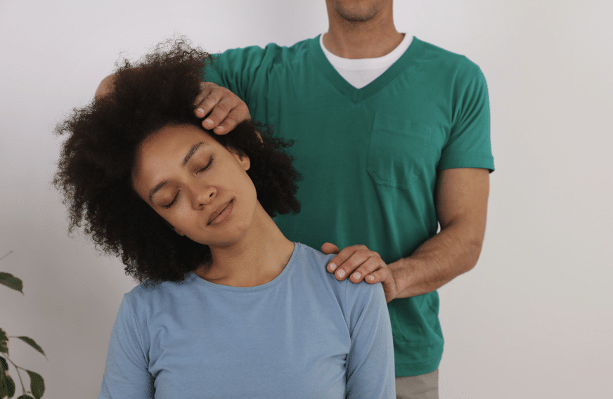 Chiropractor adjusting neck after whiplash injury in Frankfort